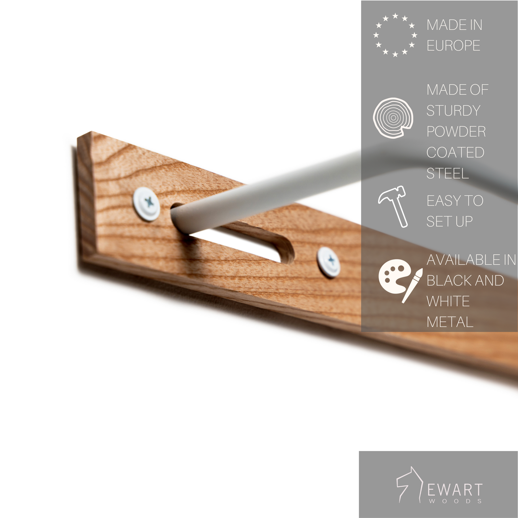 Close-up of a wooden towel rack with visible screws, a white metal bar. The image includes product labels stating Made in Europe, Made of sturdy powder-coated steel, Easy to set up, Available in black, white metal.