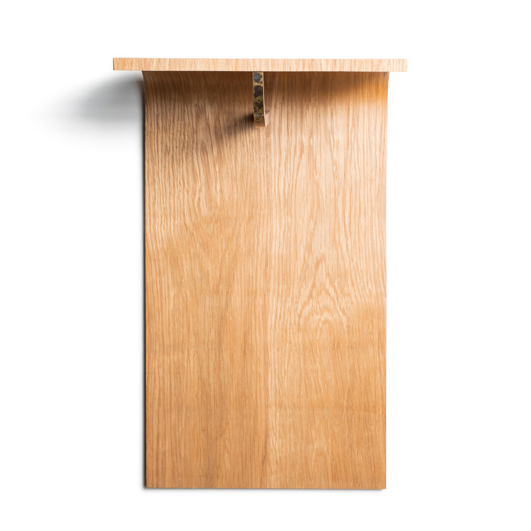 Clear front view of wood wall mounted hanger rack with brass accent on front