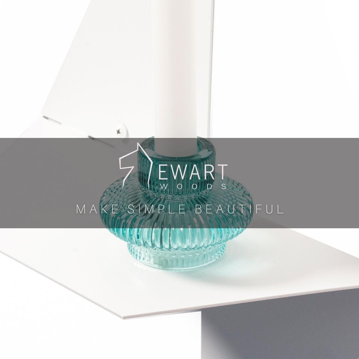 Close-up of white floating wall metal shelf in geometric shape
