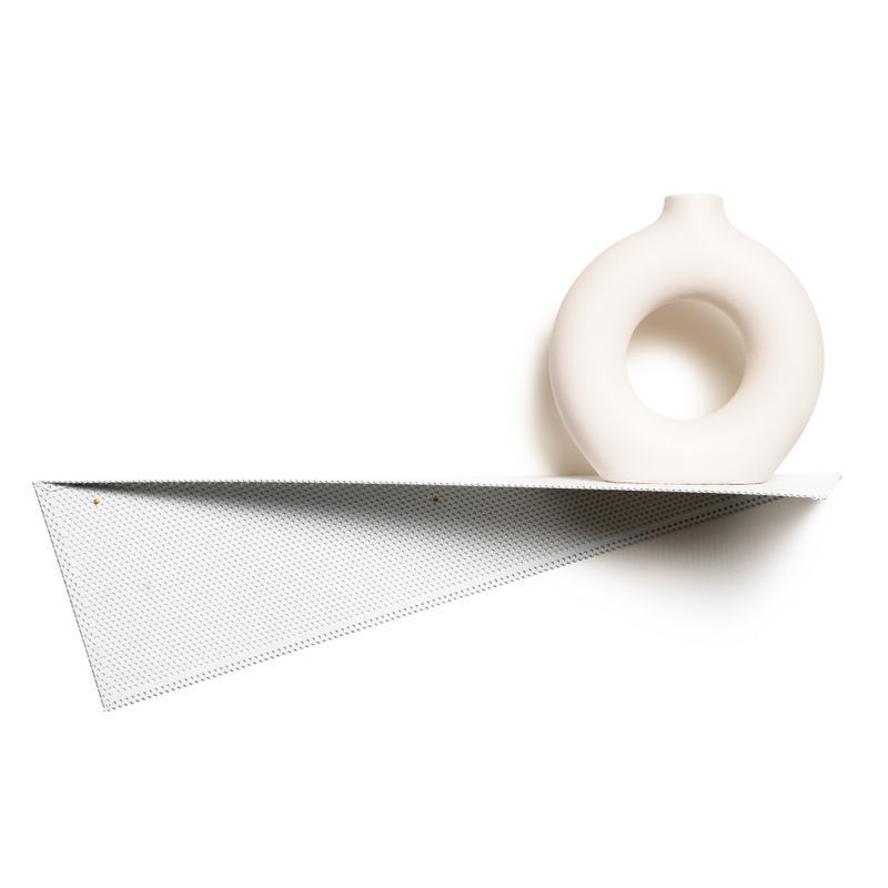 Perforated metal wall shelf with a unique triangular design, featuring a minimalist white ceramic vase as decor.