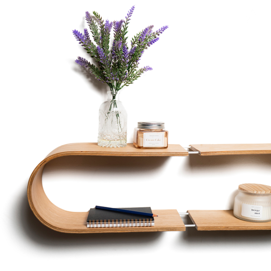 Modern oval shaped wooden wall shelf with a smooth curved design