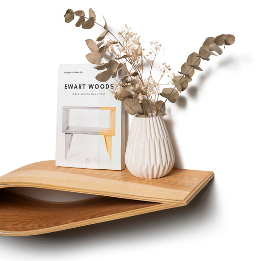 Wooden floating shelf in fish form close-up surface display