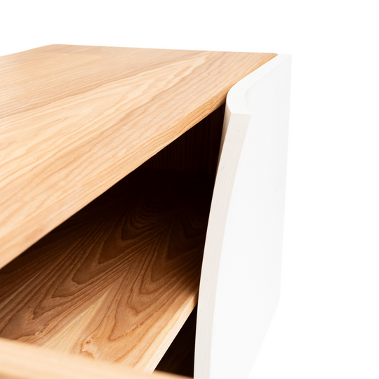 Close-up of modern wooden buffet cabinet with storage with colored door