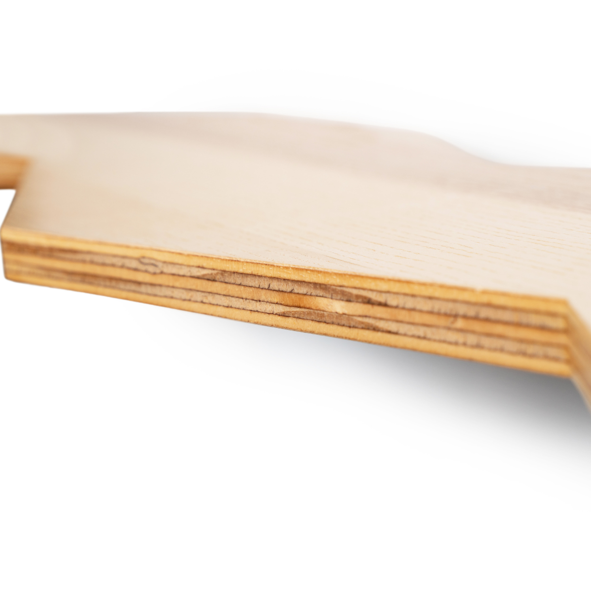 Close-up of the edge of a wooden shelf, highlighting its layered construction and smooth finish. The image shows the natural grain and texture of the wood.