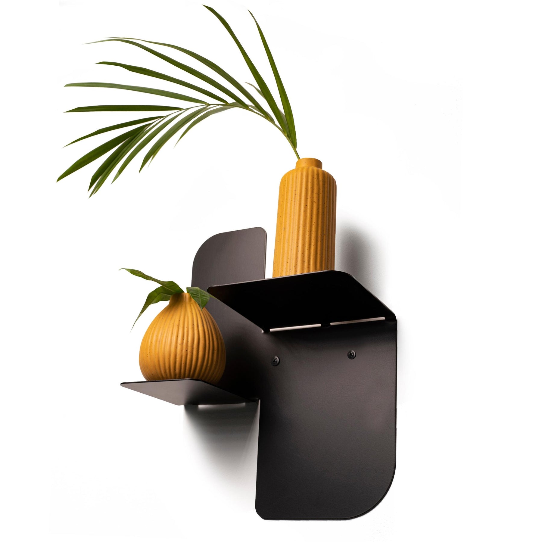 Floating black metal wall shelf with two tiers, crafted from durable steel with a matte finish and rounded edges. Designed for secure wall mounting with visible screws.