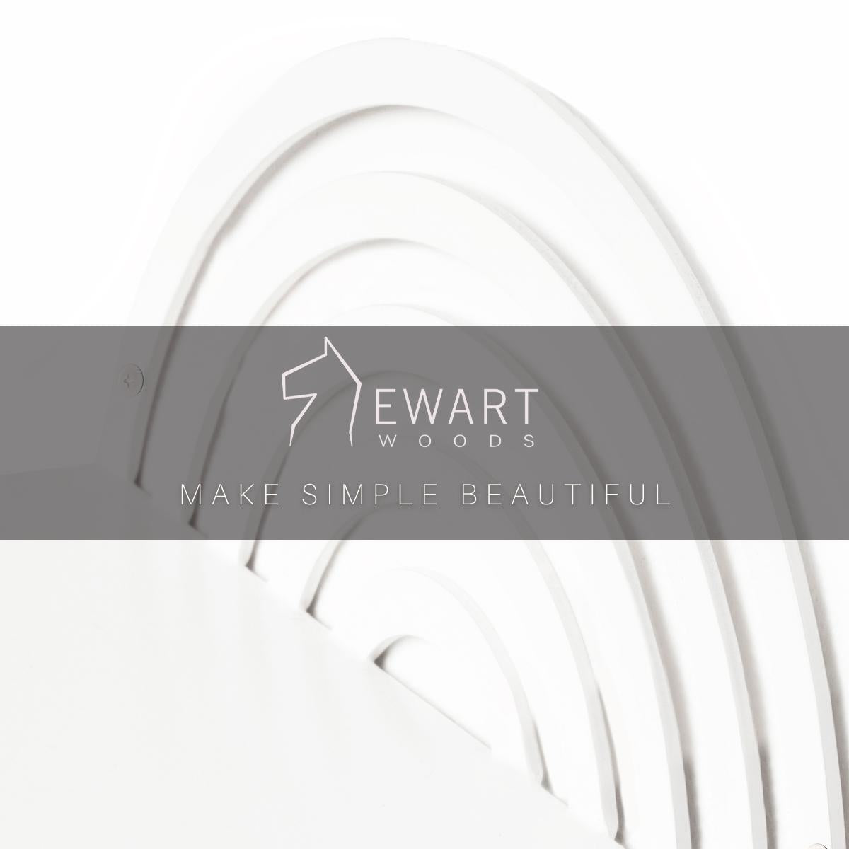 Close-up of a white, semi-circular metal shelf with a concentric, arched pattern. 