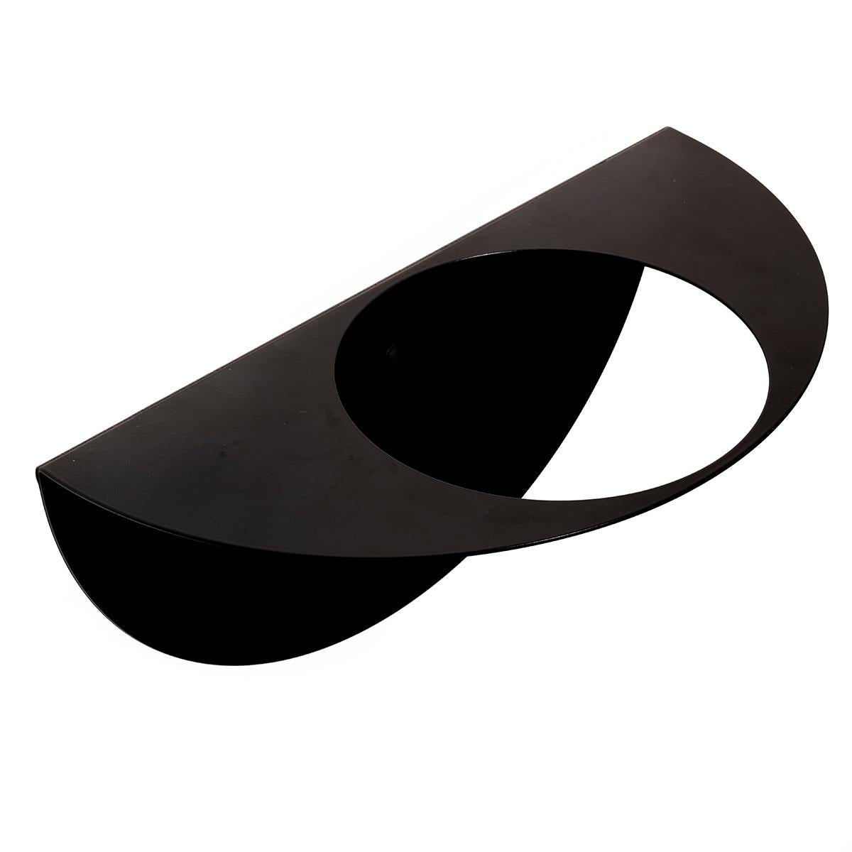 Black wall-mounted metal shelf with a curved design and a central circular space for holding a small plant pot or decorative item.