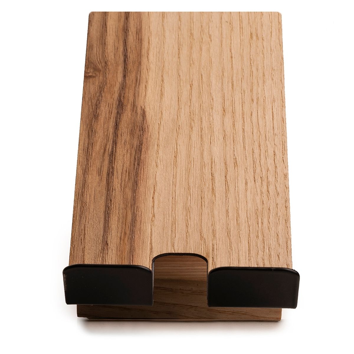 Top view of a phone stand with a wooden surface, featuring black metal supports for holding a phone and an integrated charging slot.