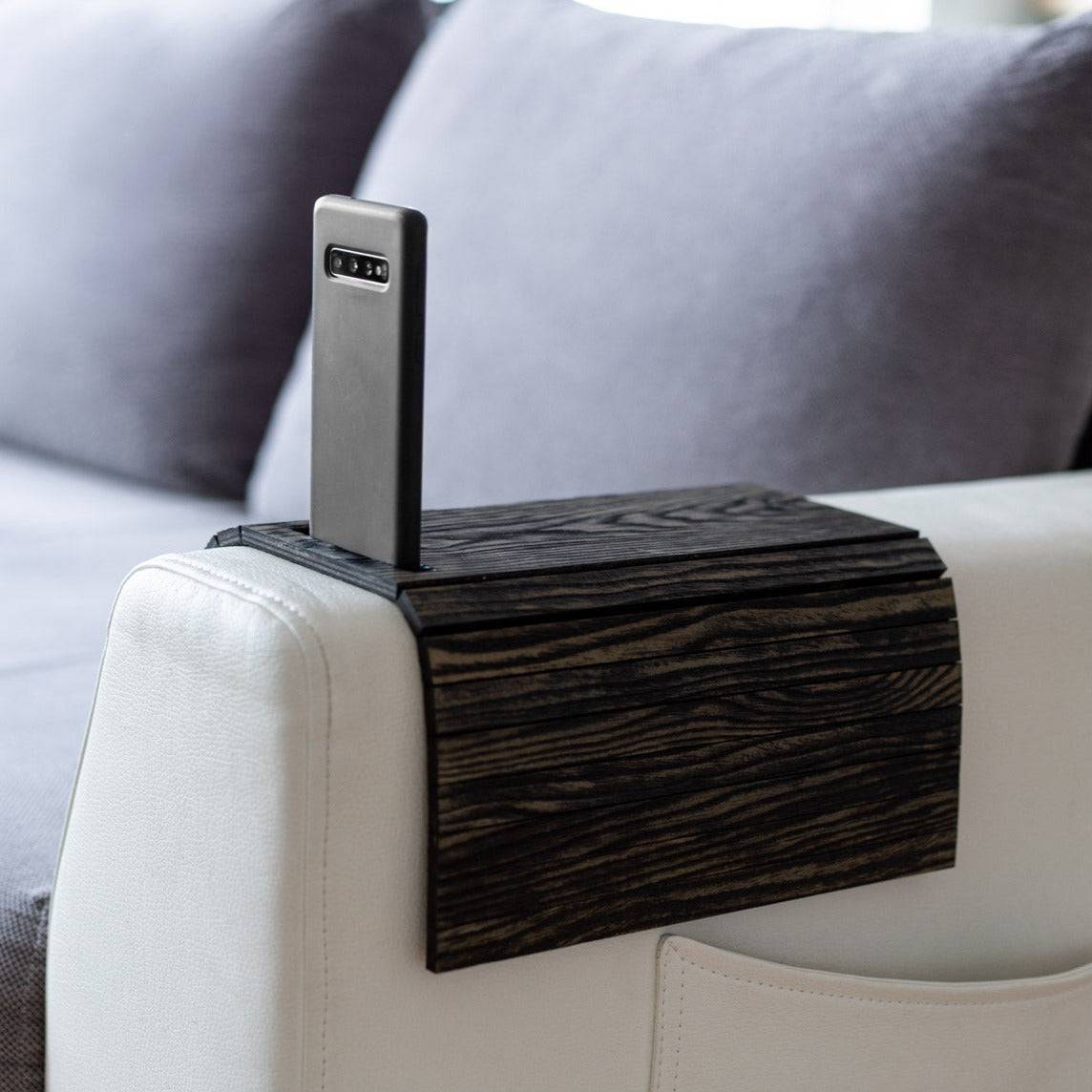 Burned Wooden Sofa Arm Tray Table on a couch arm, showcasing its versatility and stylish burnt wood finish. EWART WOODS